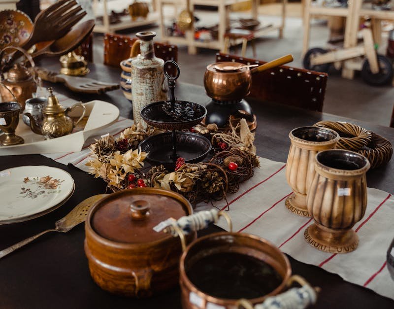 Charming collection of antique kitchenware and decor on display indoors, exuding vintage elegance.